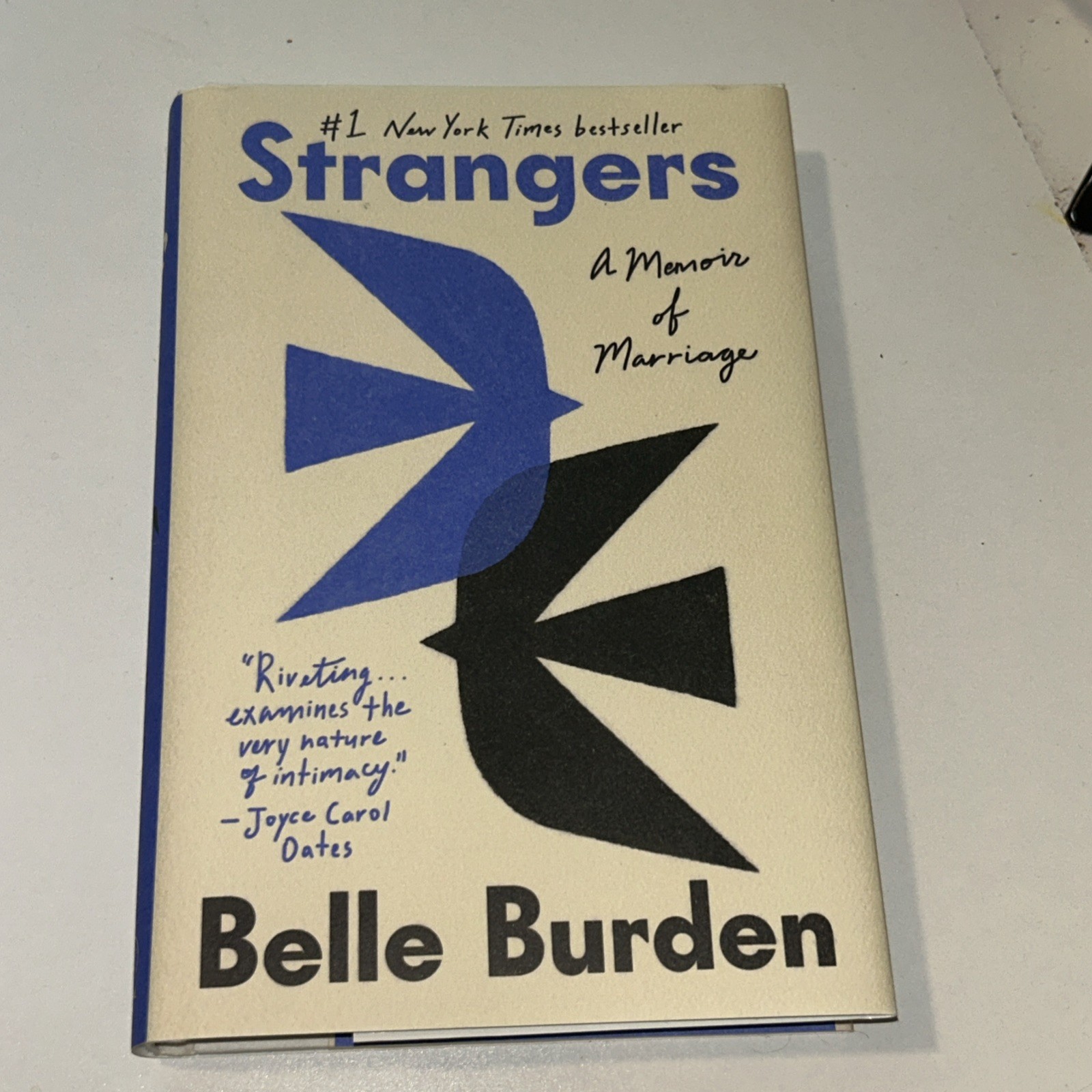 Strangers: A Memoir of Marriage, Burden, Belle . Hardcover. Used Good Conditions